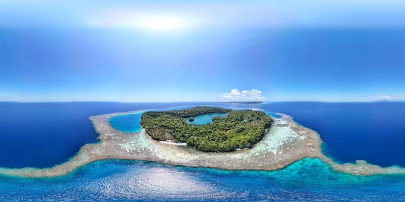 Vista aérea cenital de una isla tropical con formaciones kársticas y arrecifes en el archipiélago de las Islas Togian en Sulawesi.